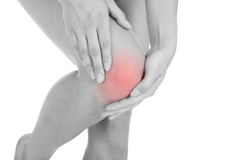Hands holding knee with highlighted pain area for pain relief